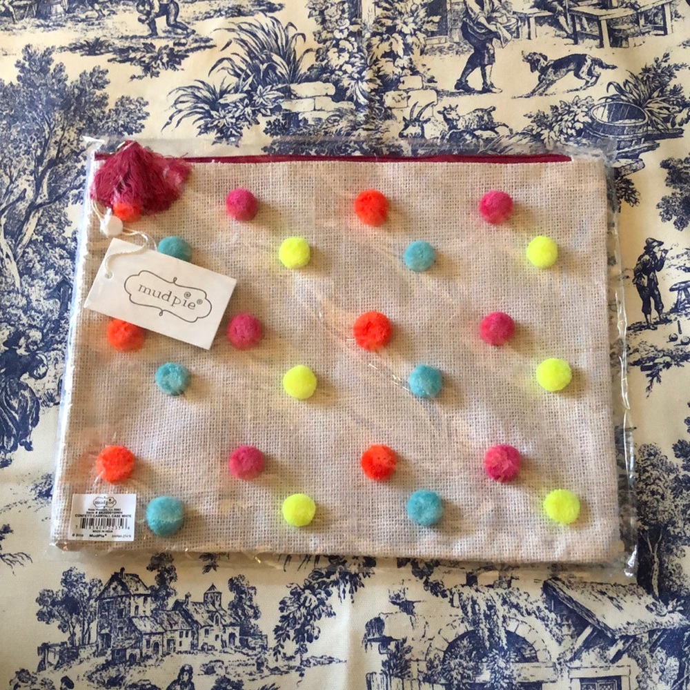 Mudpie pom-Pom clutch bag